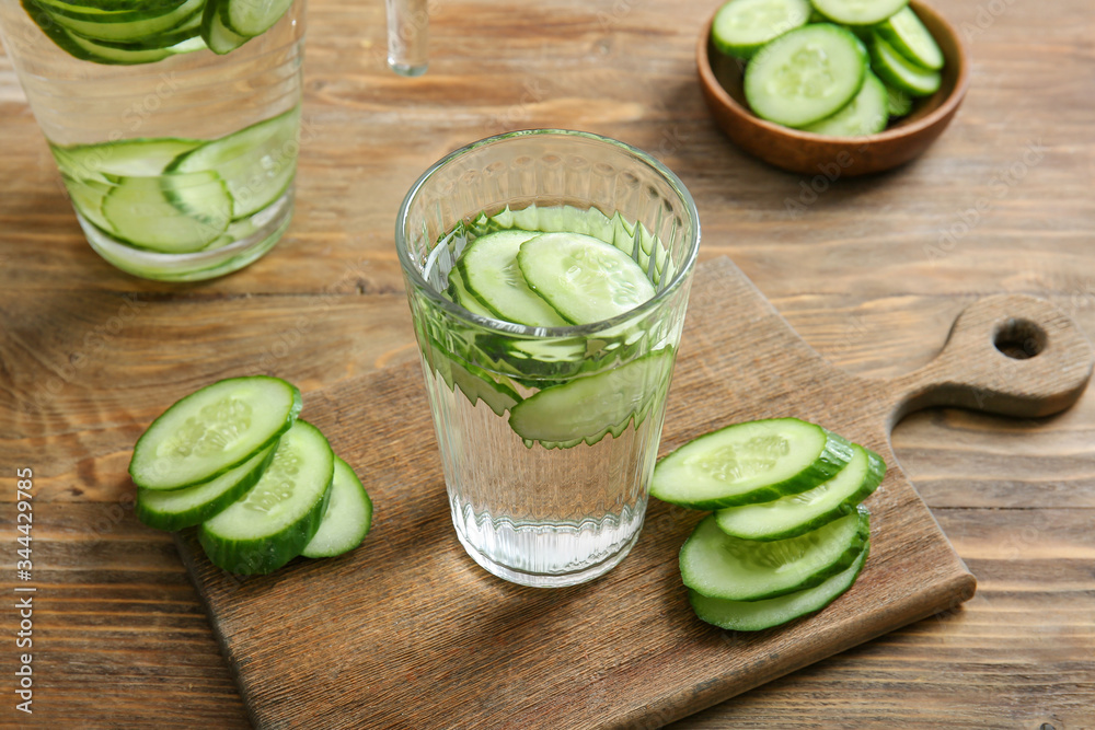 Glass of cucumber infused water on table