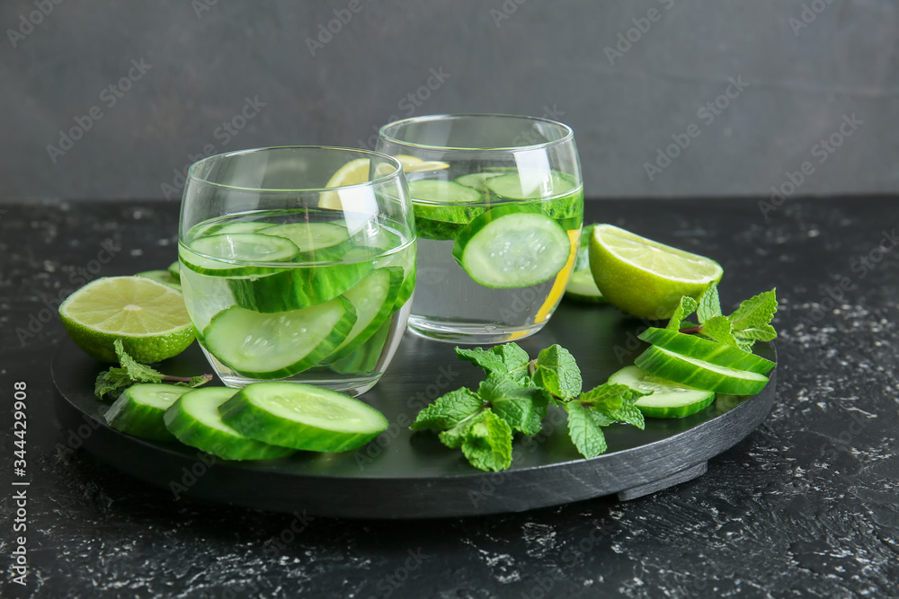 Glasses of cucumber infused water on table