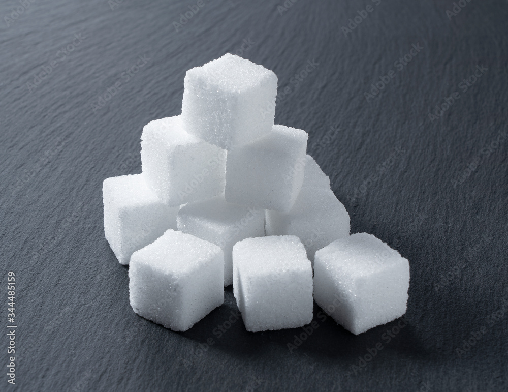 Sugar cubes placed on a black background