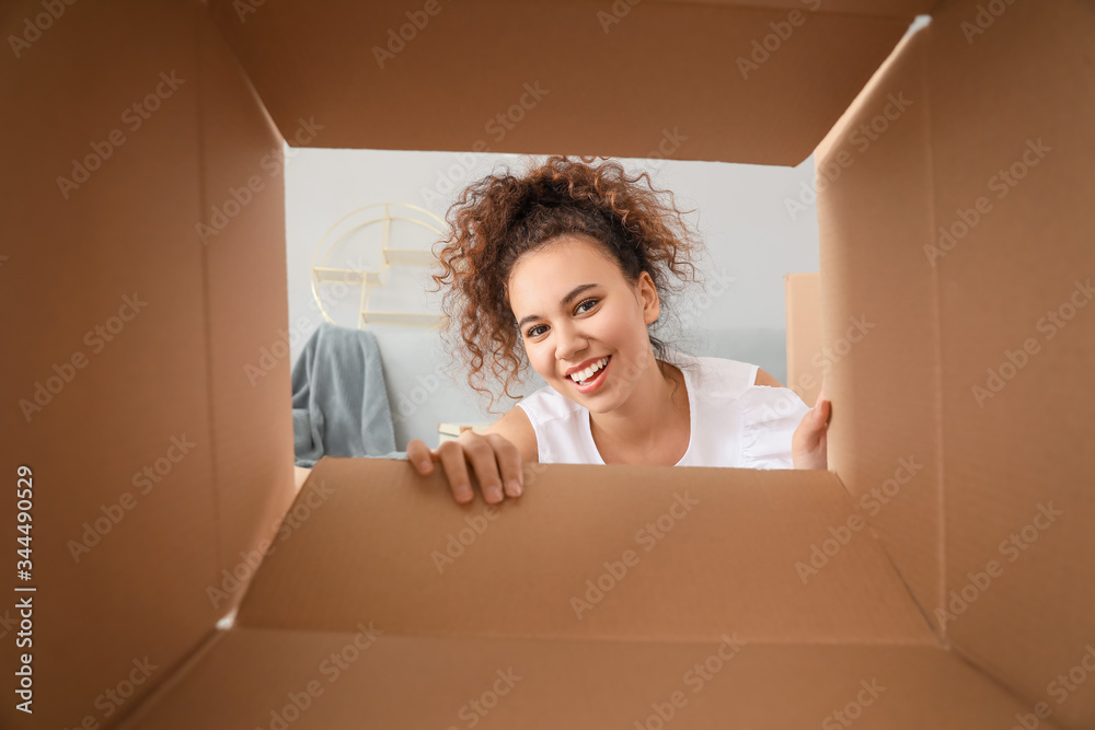 Happy woman with open box, view from inside