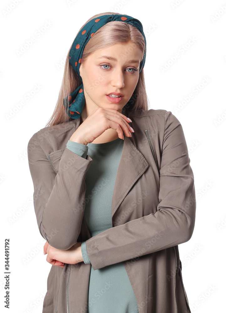 Beautiful young woman with stylish scarf on white background