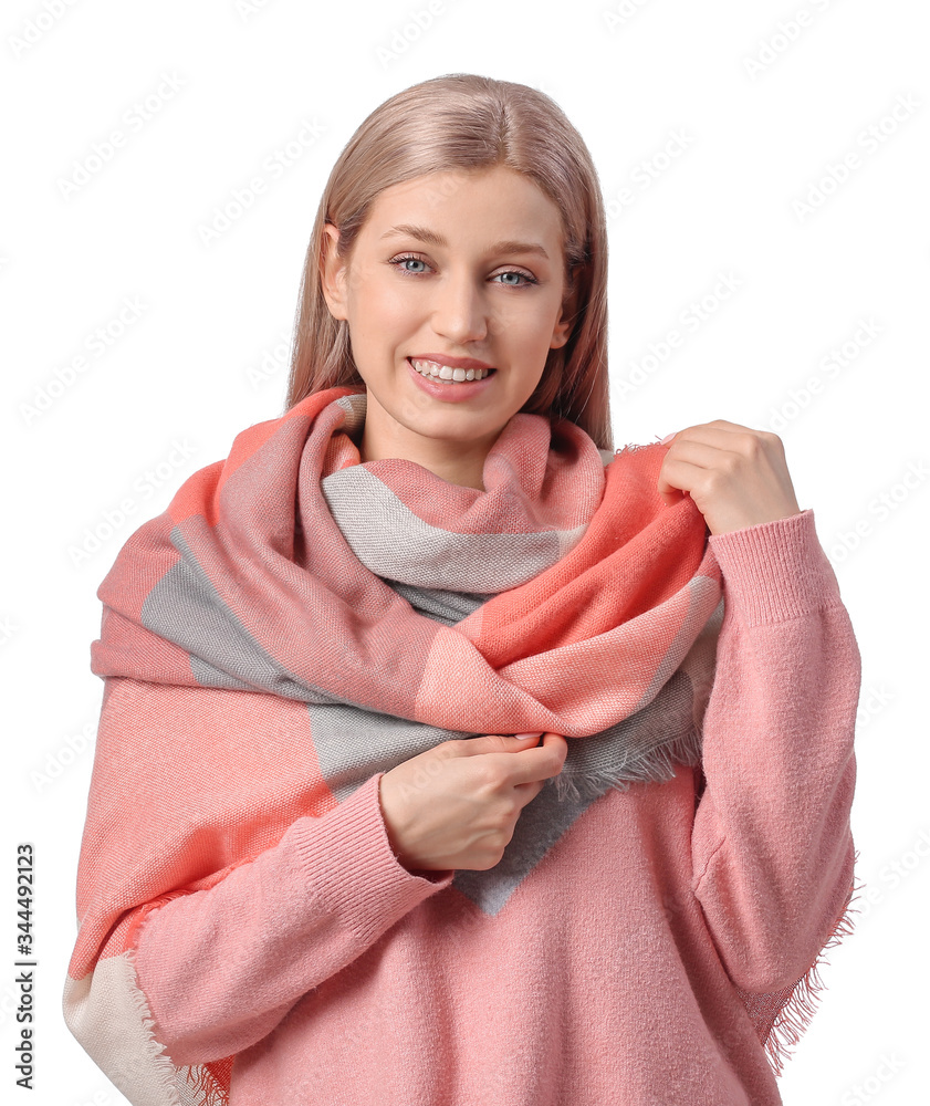 Beautiful young woman with stylish scarf on white background