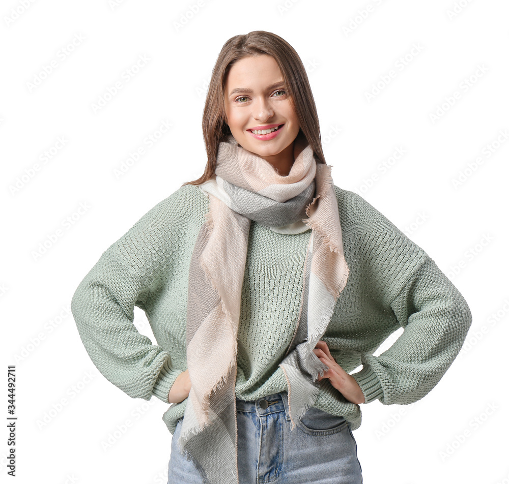 Beautiful young woman with stylish scarf on white background