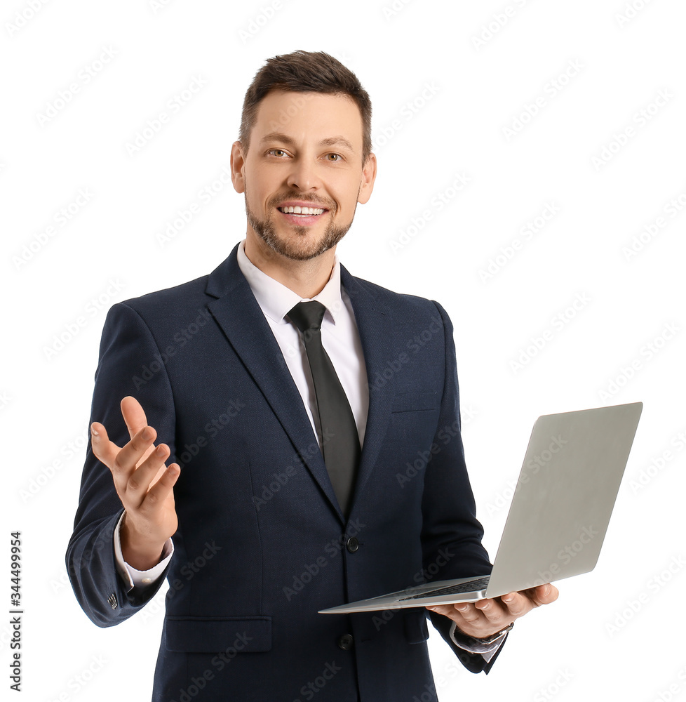 Portrait of handsome businessman with laptop on white background