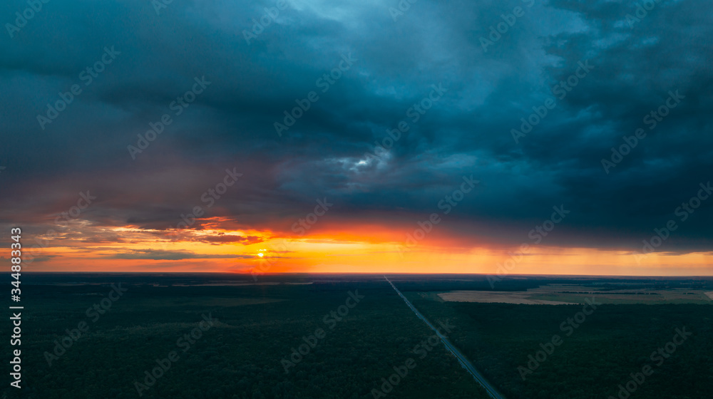 Aerial View Of Sunset Sky Above Highway Road Through Green Forest Landscape In Sunny Evening. Top Vi