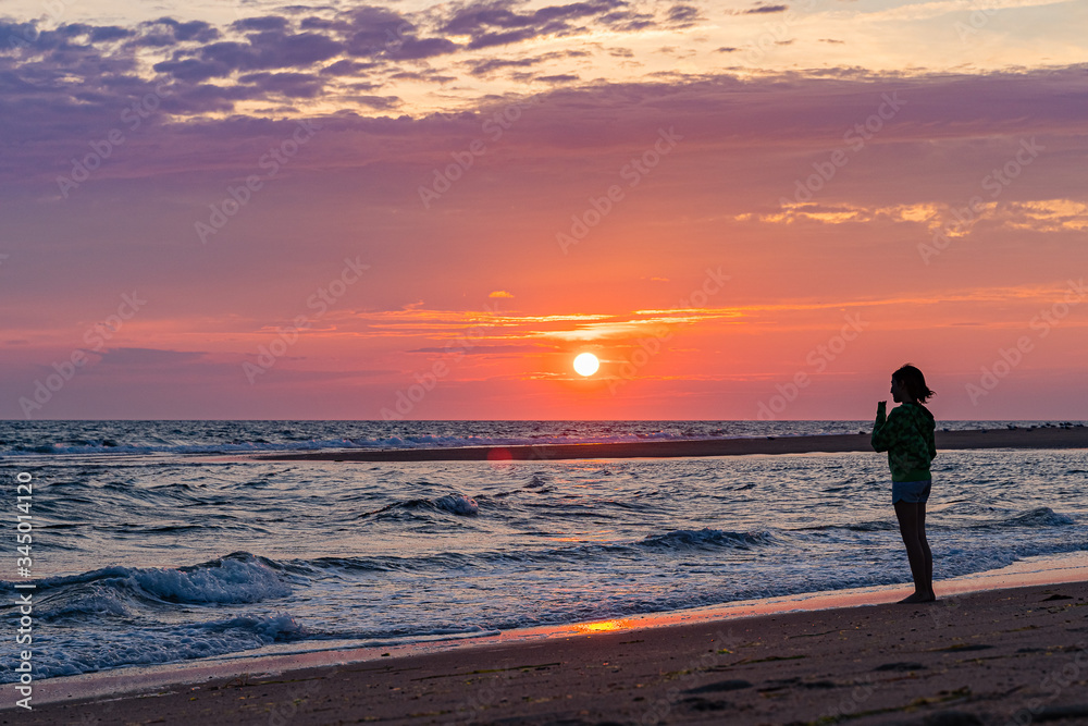 Sunset on the beach on north side of the Provincelands Cape Cod, Atlantic ocean view MA US.