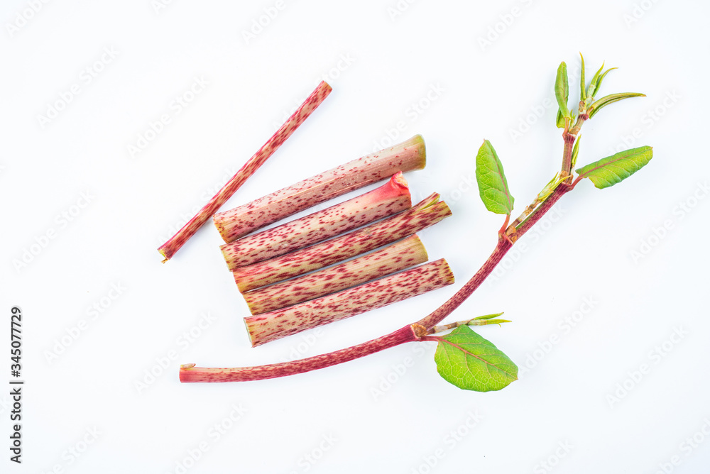 Sour tube rods with fresh wild herbs on white background