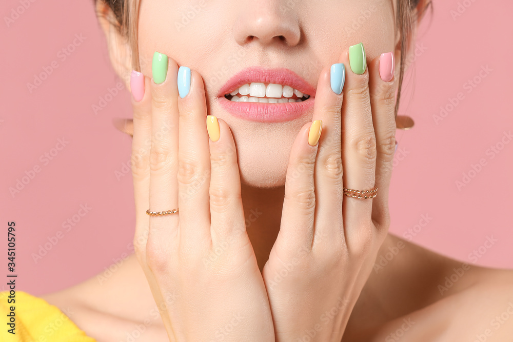 Young woman with beautiful manicure on color background, closeup