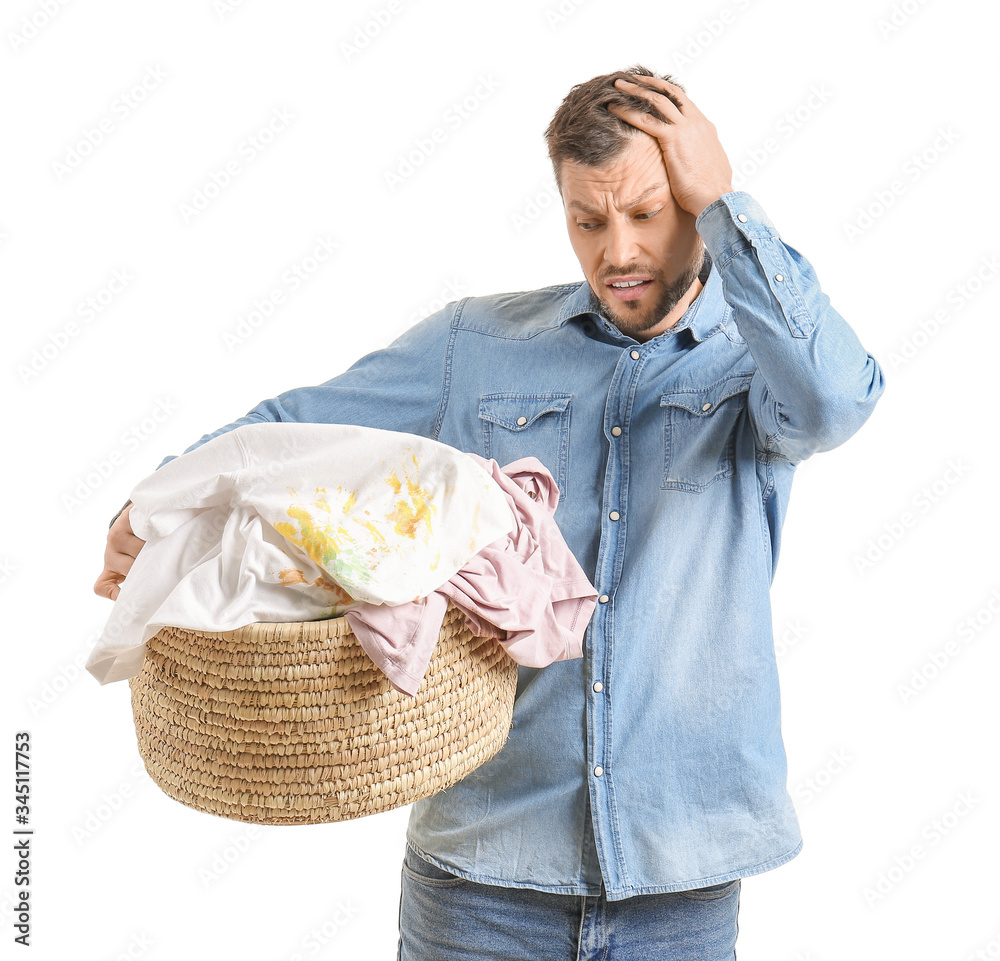 Displeased man with dirty clothes on white background