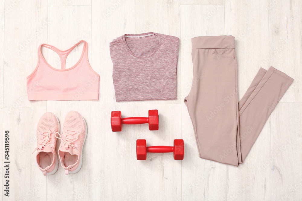 Composition with sportswear on wooden background