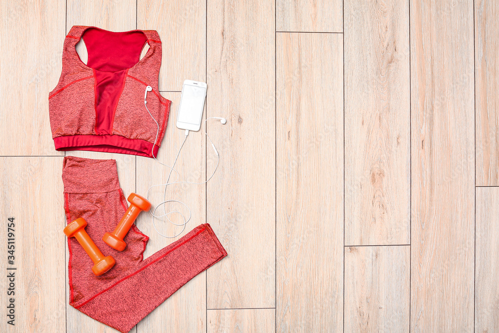 Composition with sportswear on wooden background