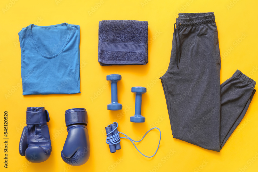 Composition with sportswear on color background