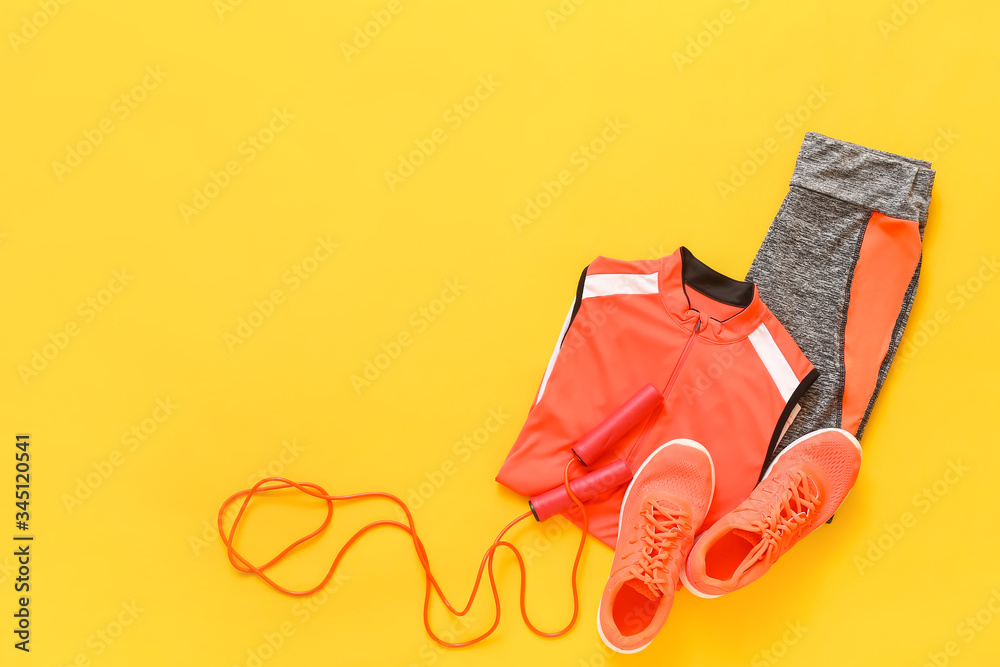 Composition with sportswear on color background