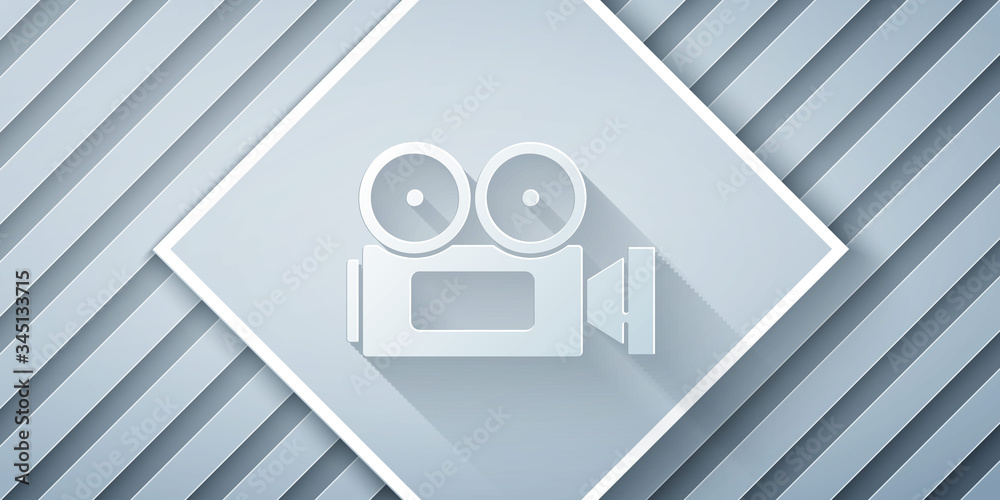 Paper cut Cinema camera icon isolated on grey background. Video camera. Movie sign. Film projector. 