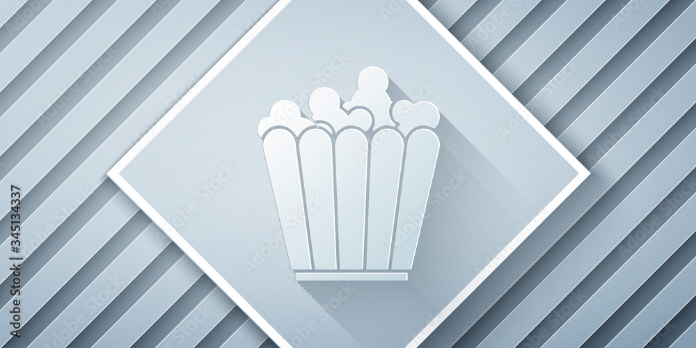 Paper cut Popcorn in cardboard box icon isolated on grey background. Popcorn bucket box. Paper art s