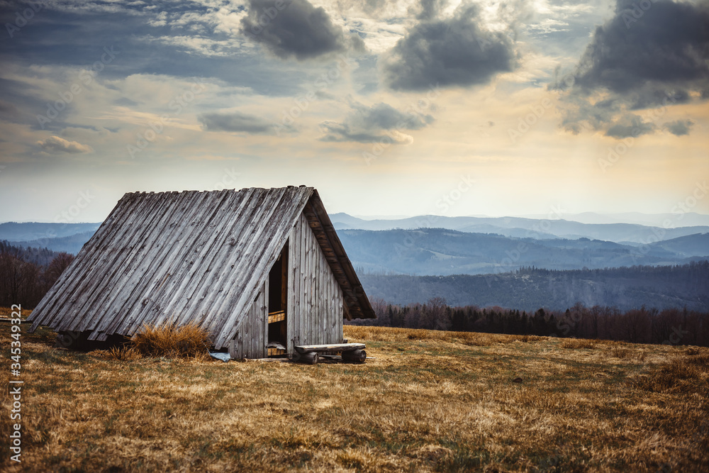 Old wooden shelter in mountain carpathian landscape Brenna Poland