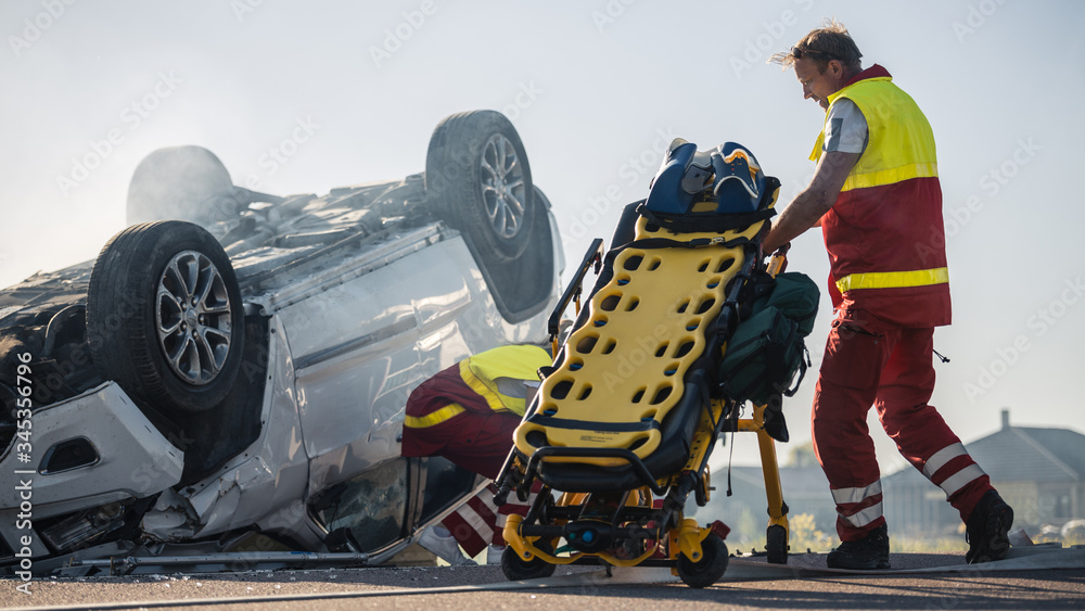 Paramedics and Firefighters Arrive On the Car Crash Traffic Accident Scene. Professionals Prepairing