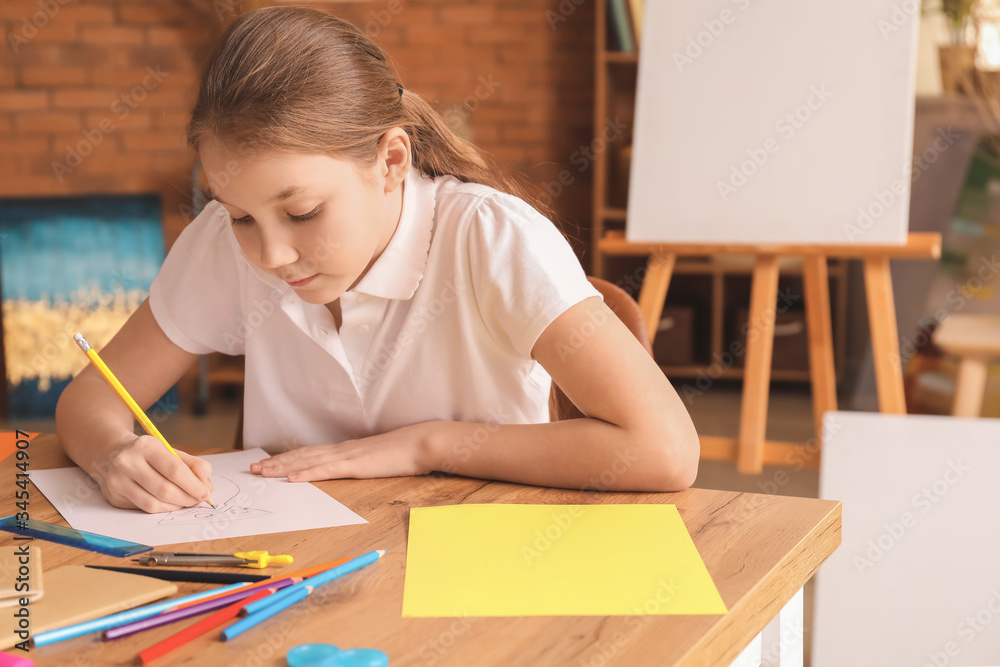 Cute girl drawing at school