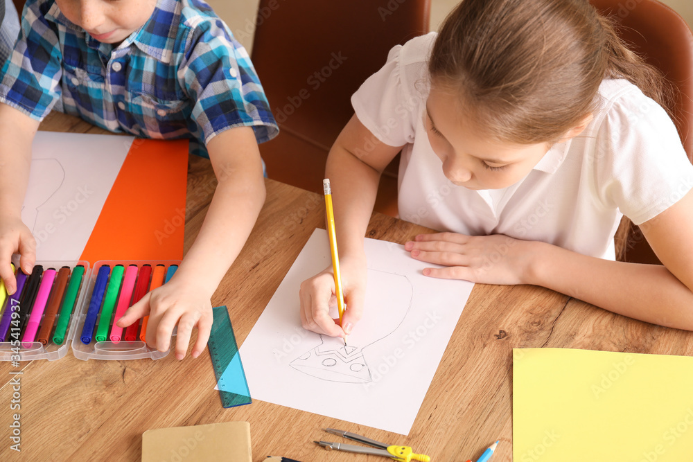 Cute children drawing at school