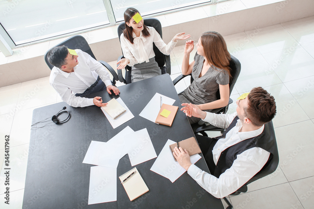 Team of business people playing who I am