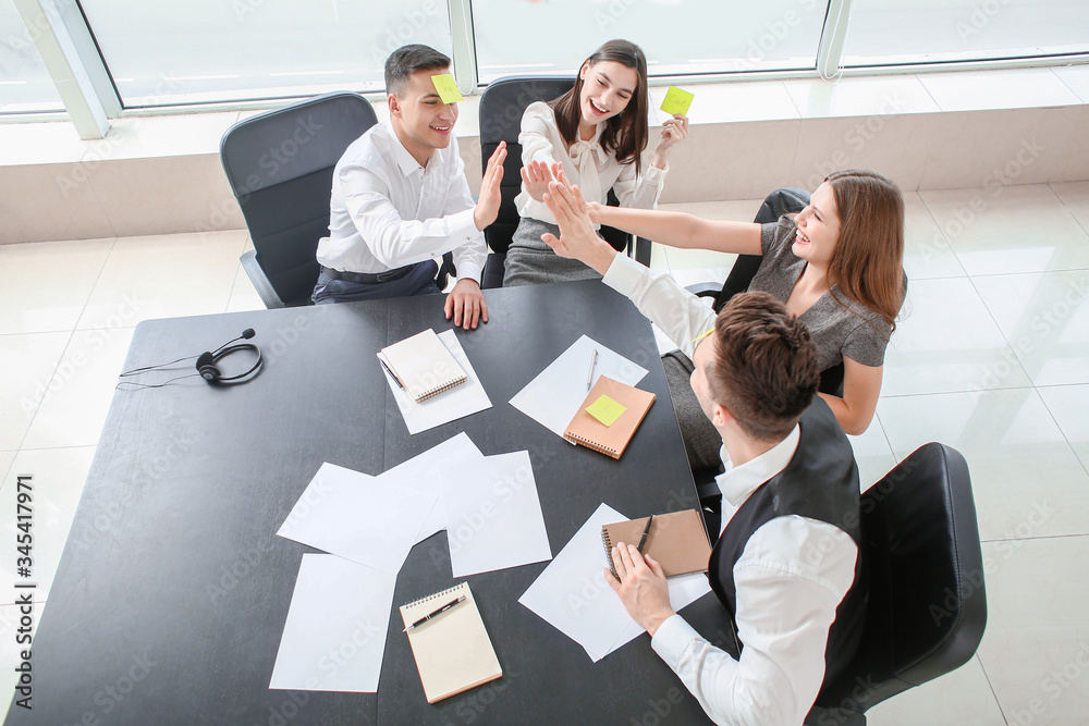 Team of business people playing who I am