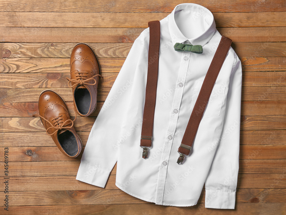 Stylish school uniform on wooden background