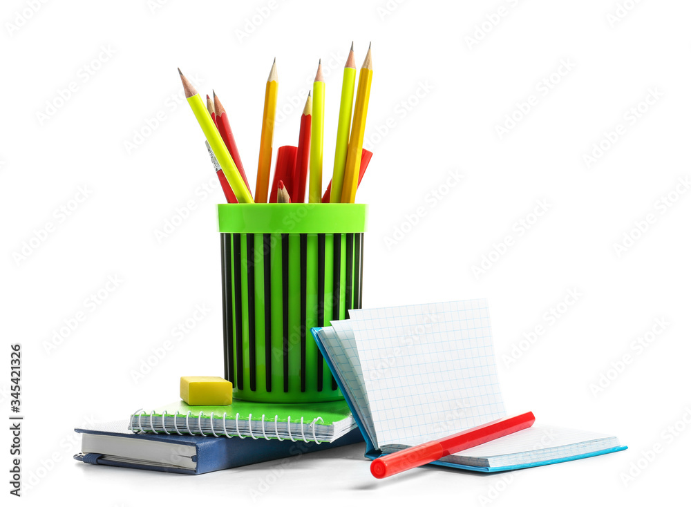 Holder with stationery on white background