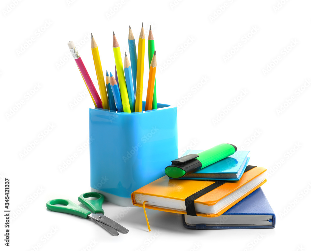 Holder with stationery on white background