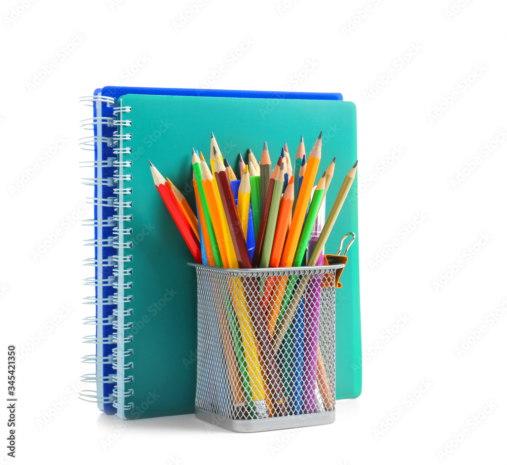 Holder with stationery on white background