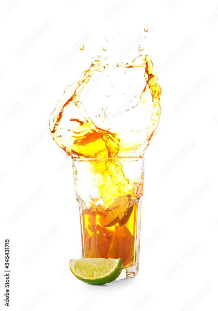 Glass of tasty cold ice tea with splash on white background