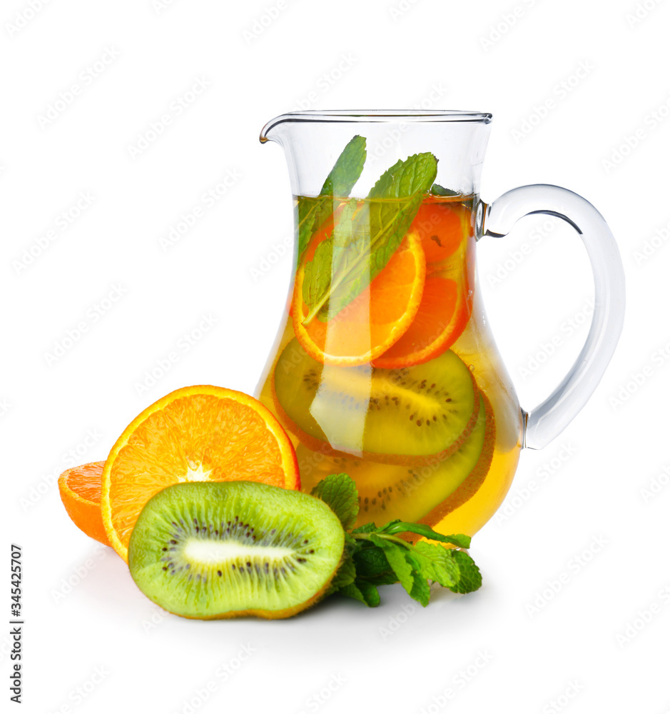 Jug of tasty cold tea on white background