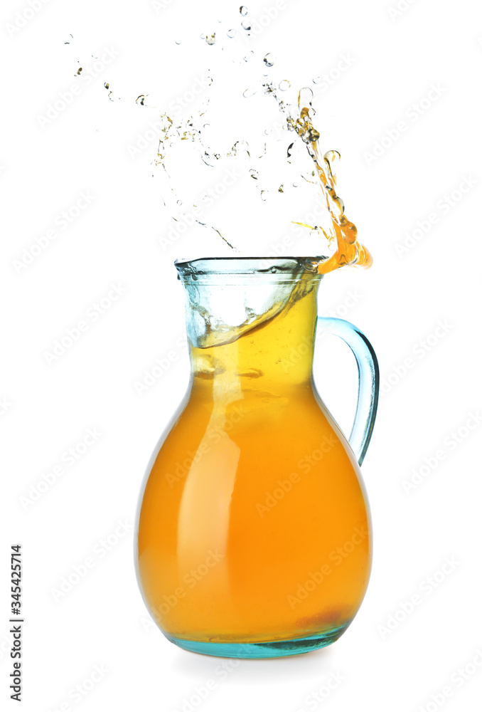 Jug of tasty cold ice tea with splash on white background