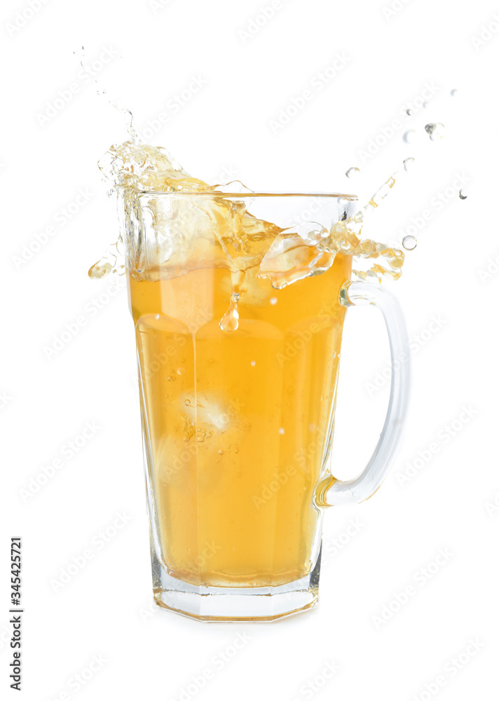 Jug of tasty cold ice tea with splash on white background