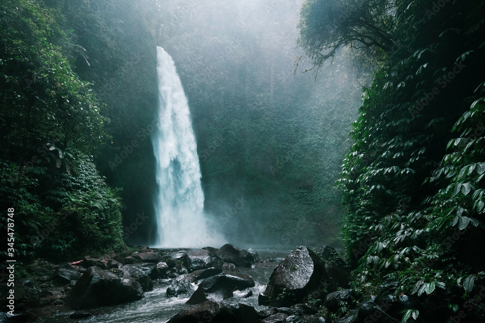 Secret Bali jungle waterfall near Ubud, Indonesia