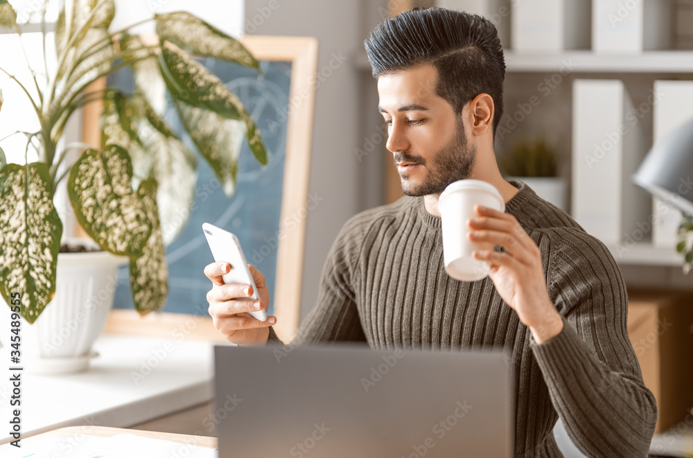 man working on a laptop at home.