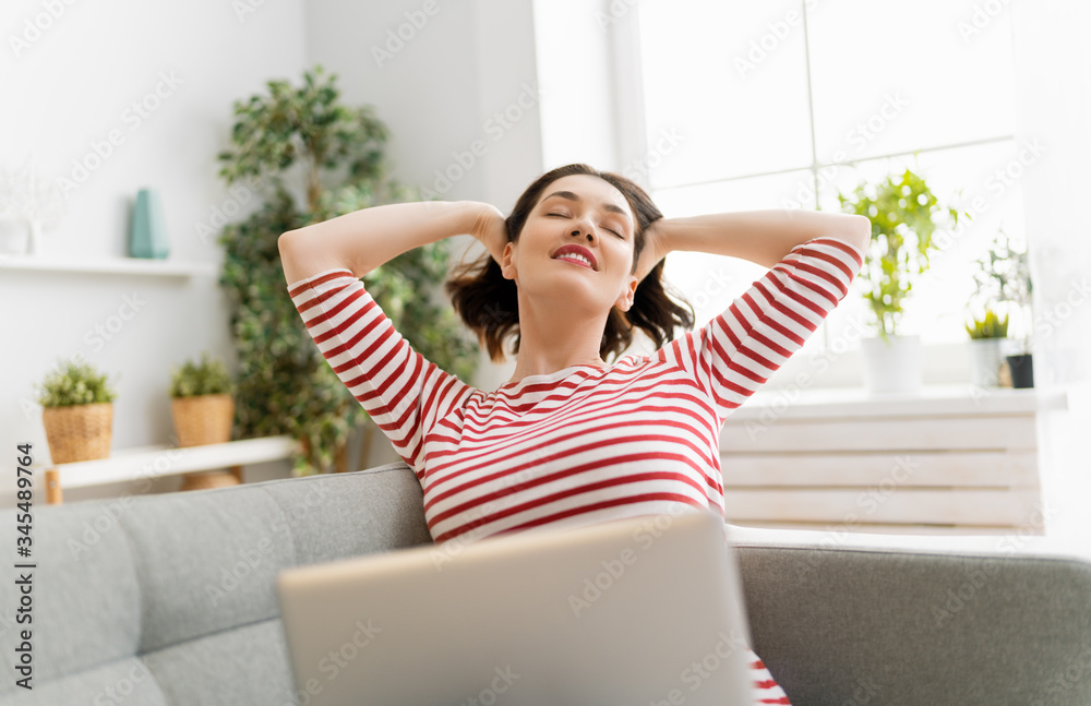 woman working on a laptop at home.