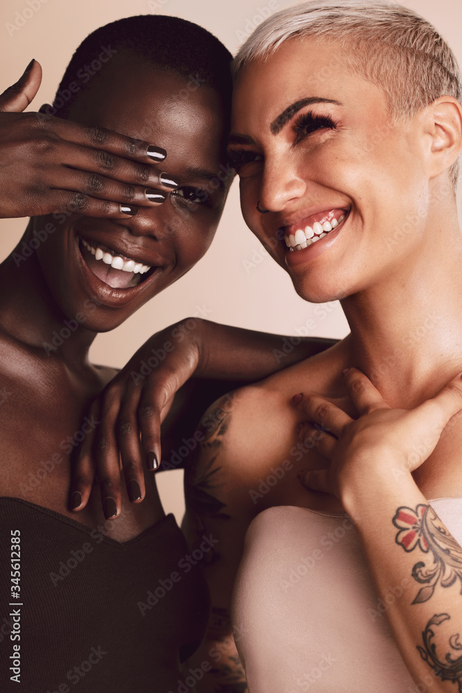 Attractive female models smiling in studio