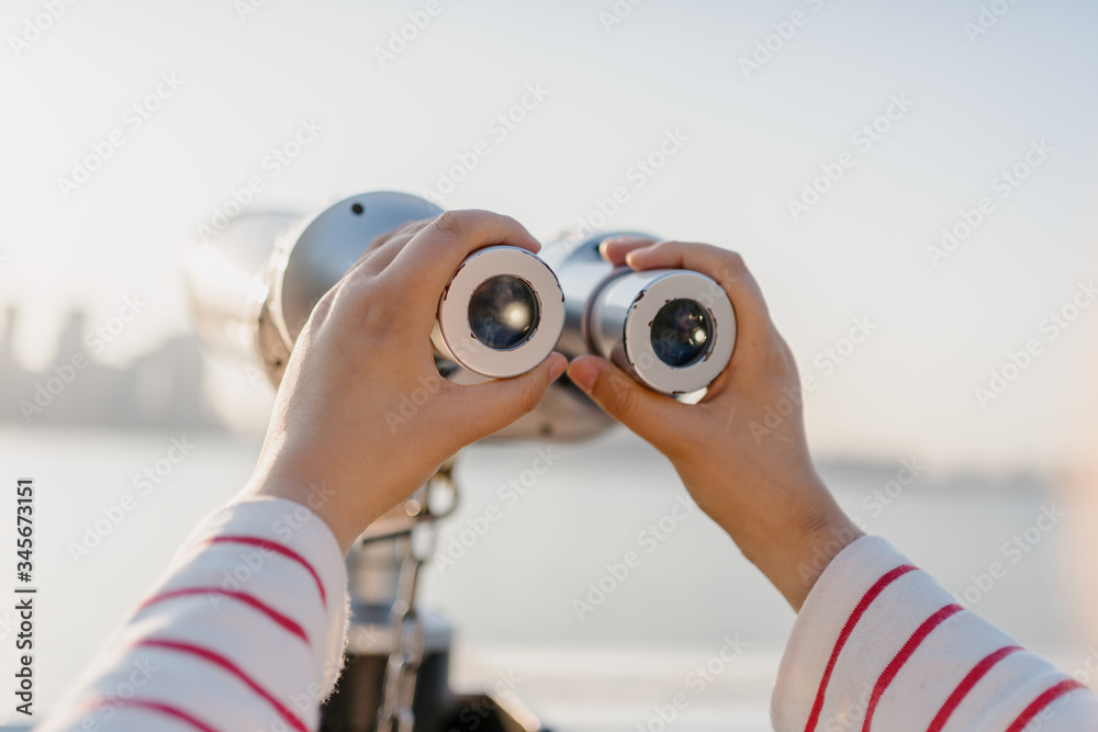 coin operated binoculars with city skyline