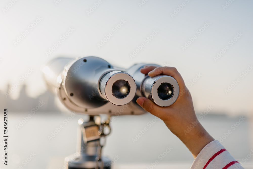 coin operated binoculars with city skyline