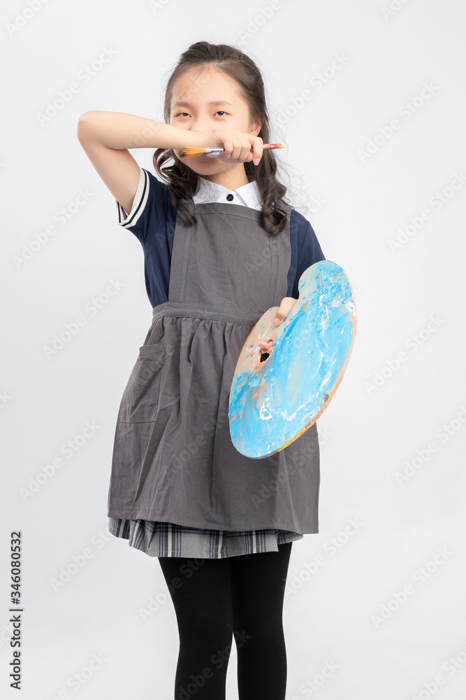 Asian primary school girls who are painting