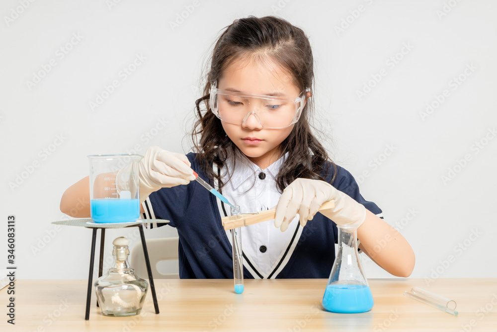 Asian primary school girls doing chemical experiments