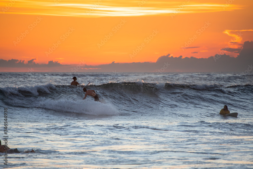 Sunset with surfing in Bali