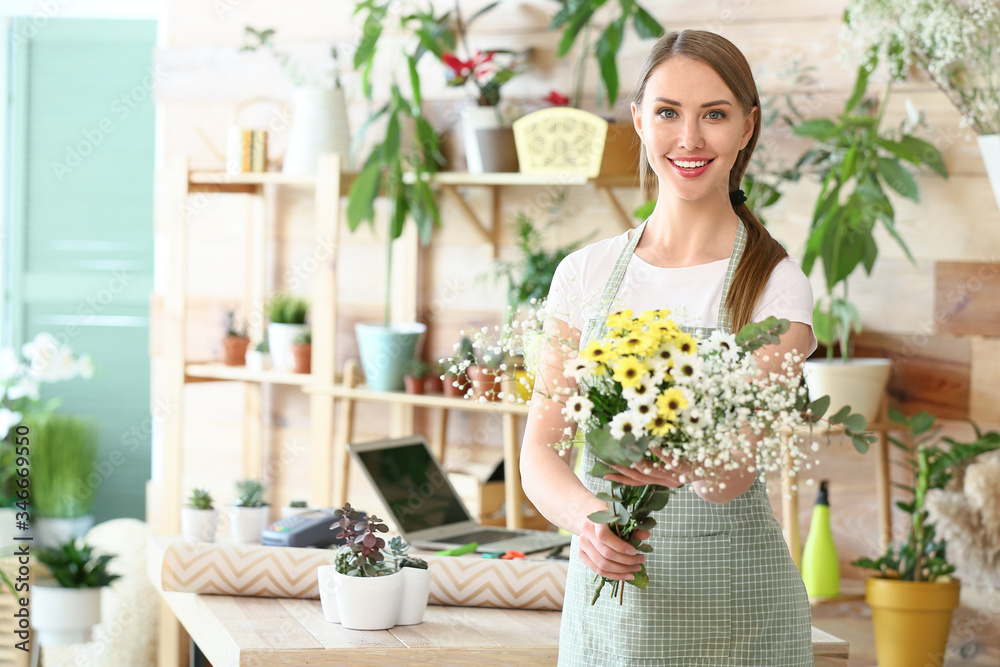 Portrait of female florist in shop