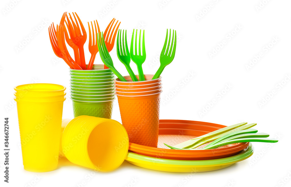 Set of plastic tableware on white background