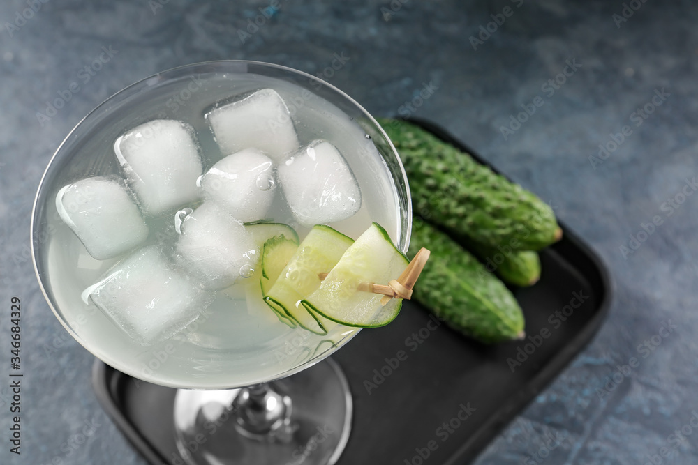 Glass of tasty cucumber martini on table