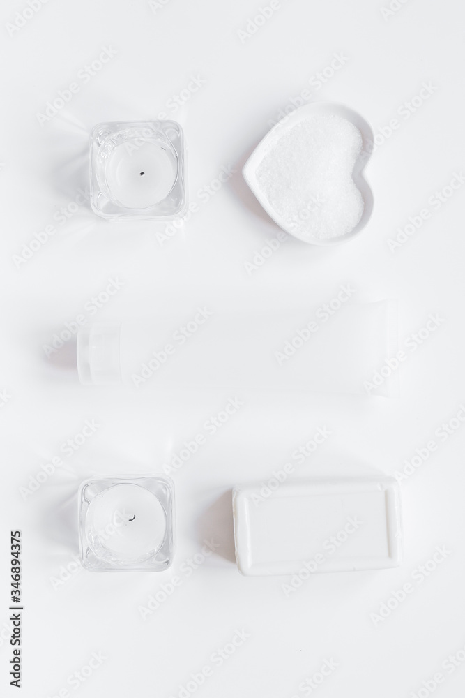 white cosmetic set on desk background top view space for text