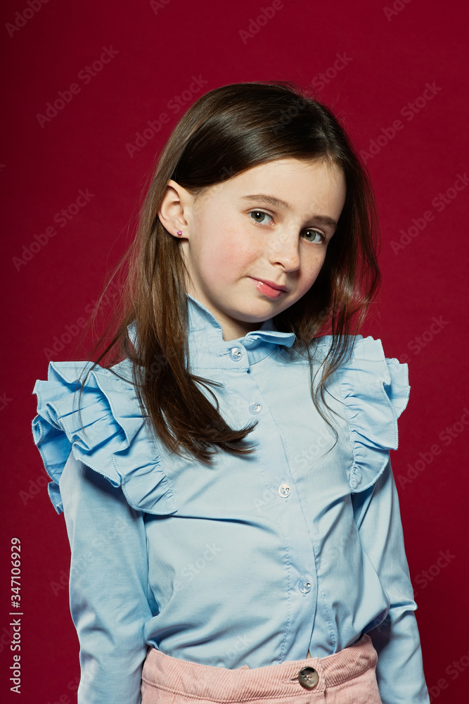 portrait of a beautiful girl on a red background