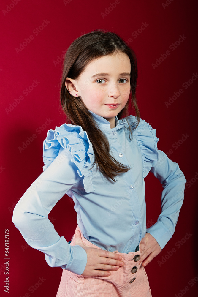 portrait of a girl on a red background, large expressive eyes and beautiful dark hair