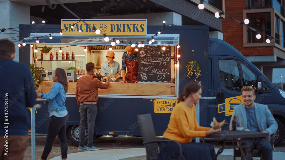 Food Truck Employee Hands Out a Card Card Terminal For Contactless Payment to Happy Young Hipster Cu