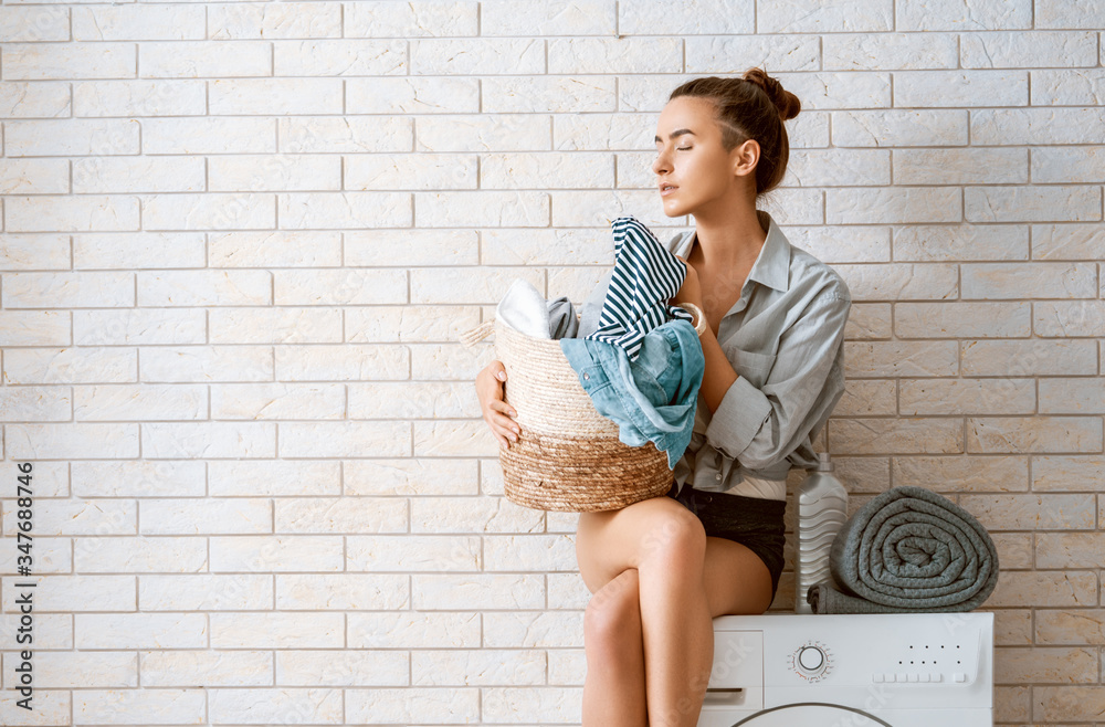 woman is doing laundry